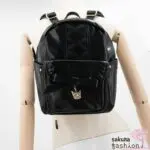 axes femme POETIQUE Kunstlederrucksack Schwarz Mittelgroß Spitze Schnürung Schleife Sanrio Kuromi Metallanhänger Gold Japan Kawaii Feminin kuromi bagpack with charm